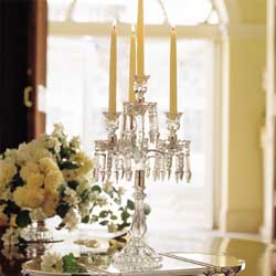Gleaming crystal table sconces with candles illumi