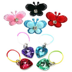 Accessorize your pooch with glitzy hearts or adorable sparkly butterfly hair bands.  The glitzy hear