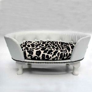 This luscious dog bed has a white vinyl back with button detail and a snow leopard velour beanbag