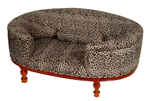 A very luxurious sofa dog bed for man`s best friend, covered in exotic leopard print material