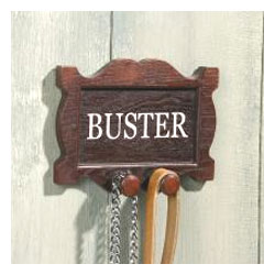This handsome wood-effect wall-mounted lead holder can be personalised with the name of your dog