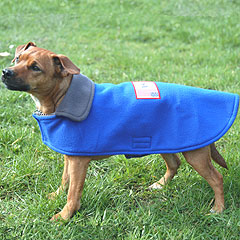 Made from brushed fleece, this reversible coat is machine-washable, and sports an embroidered label 