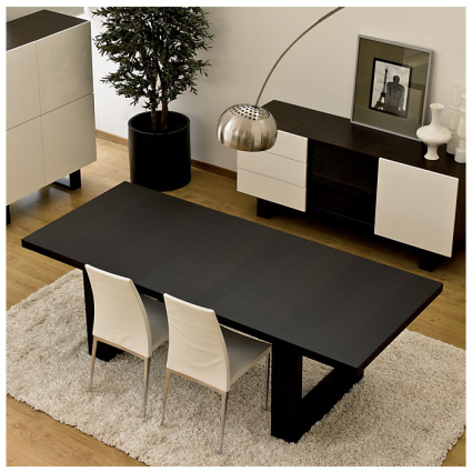 The Drada Dining Table is a piece of elegant contemporary design. Finished in dark wenge wood veneer
