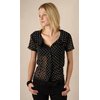 This pretty little Elaine blouse is a black, slightly sheer fabric with white polka dot print. Perfe
