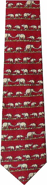 A lovely tie featuring adult & baby elephants holding tails on a red background