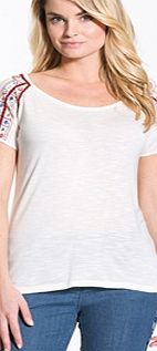 Embellished Scoop Neck T-Shirt. This lovely fresh-looking softly draping T-shirt is embellished with pretty embroidery... just perfect with jeans! It has a round scoop neckline, pure cotton voile raglan sleeves embellished with embroidery, beads and 