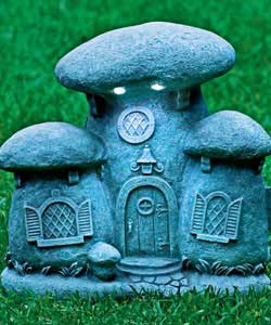 Mushroom house light made from polystone. Colour grey. Requires 4 x c-cell batteries (not included).