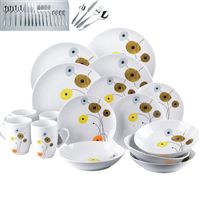 Contemporary, coupe shaped porcelain dinnerset comprises: 4 mugs, 4 bowls, 4 dinnerplates and 4