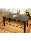 A traditional styled wooden coffee table in a dark finish with magazine undershelf/rack.Please