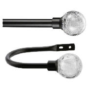 This set includes an extendable metal curtain pole and matching holdbacks.  They come in a stylish