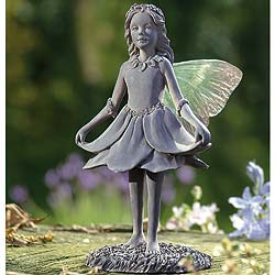 Our graceful fairy stands admiringly over the young fairy dancers in this beautifully sculpted set