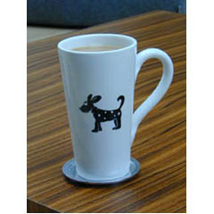 An oversized, glazed ceramic mug from Italy with a printed dog design.