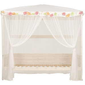 This whitewashed Swedish pine bed has a removable four-poster frame and flower canopy. It comes