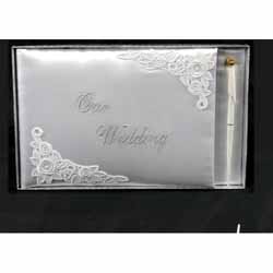 A beautiful embroidered rose  design adorns this ivory cotton cover guest book. This book has 38