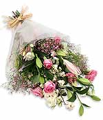 La vie en rose An armful of gorgeous candy-coloured aqua roses sweet-scented lilies pink gypsophila