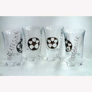 These Footballer shot glasses (set of 4)are  hand painted with  Greatest Footballer on each glass