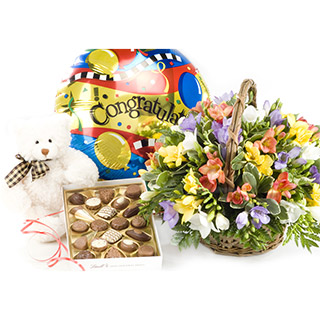 TD04 Standard Fragrant Glow basket arrangement of Freesia is delivered with a SD03 160g box of choco
