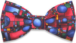 A lovely abstract bow tie with various circles and squares on a reddish background.