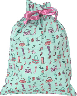 Printed cotton laundry bag, the Glaund features drawstring fastening closure.