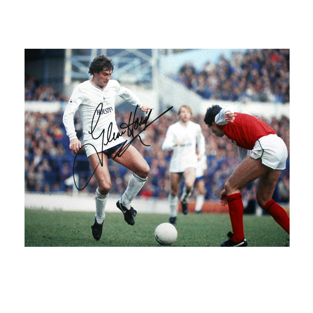 This photo shows Glenn taking on Arsenal defender David O