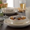 Cream stoneware set consists of 4 of each: dinner plates, side plates, dish and mug. Dishwasher and 