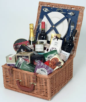 The Gourmet Christmas Basket is a traditional basket which comes with plates and cutlery for two