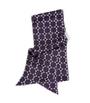 A long, floaty scarf in pure silk featuring an eye-catching purple spot design. 100 silk.