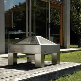 The Grill Tech Architect Firepit and Grill constructed in stainless steel features a removable ash t