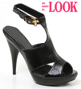 Peep toe patent sandal featuring high heel with platform, cut out detail and ankle strap. With its s