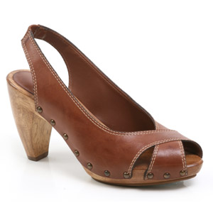 Leather sandal featuring a high wood heel with platform. The Hana shoe has an almond toe and cross o