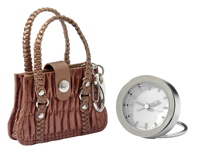 Travel Clock in A Handbag. Hopelessly addicted to handbags? Well, here you get not only a great litt
