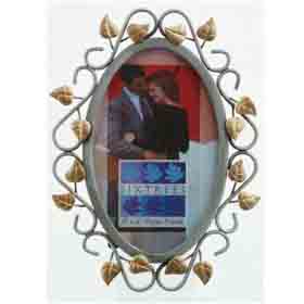 Metal photo frames with gold effect leaves. A stylish picture frame