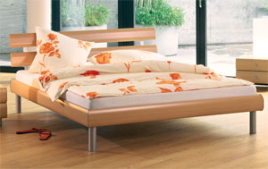 The Hasena Gorgos has the following features: Soko legs and Panele headboard both in alugloss Bed