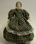By Heidi Ott, this lovely grandmother figure is dressed in a dark checked dress. She has grey