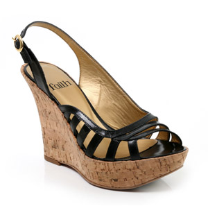 Gorgeous leather wedge sandal with strappy vamp and buckled ankle strap. The Helium shoe features a 