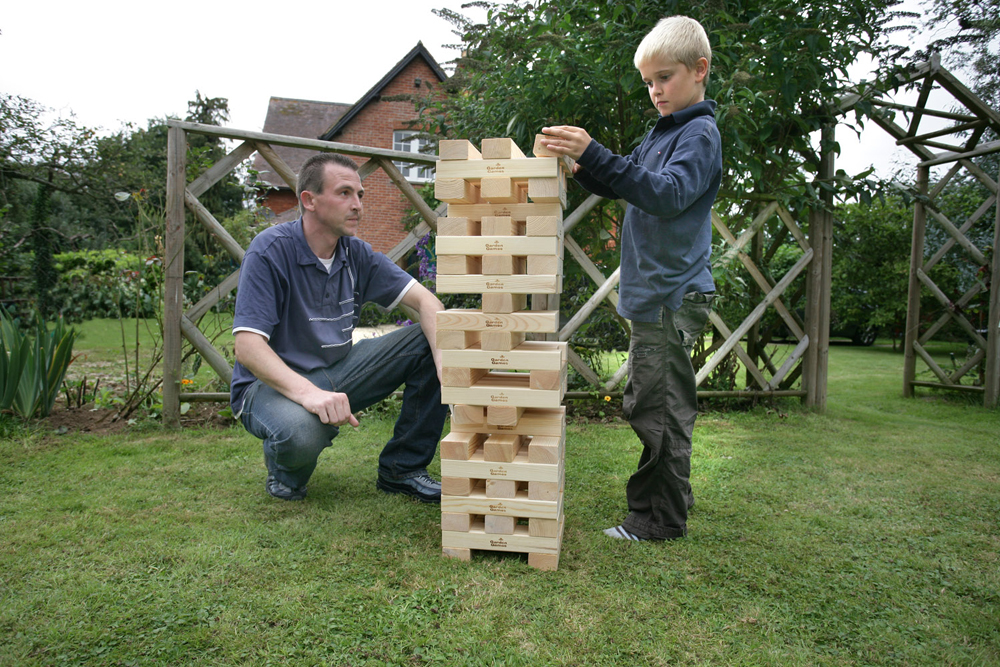 Timber! Build the tower and then take turns to remove a piece, adding it to the top without making t