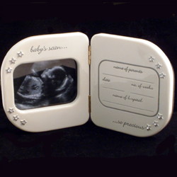A lovely gift for parents to be. This hinged baby scan photo frame allows you to put the baby scan i