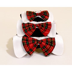 A fashionable plaid bow tie on white tabs completes the ultimate holiday pet fashion accessory to ma