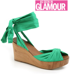 Fabric sandal with twisted front vamp and tie up ankle detail. With its high wood wedge and bright c
