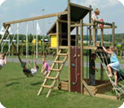 Built from square timbers this large play house, with bench seat and steering wheels, can be