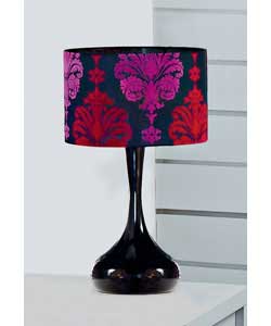 Eye-catching and dramatic, this fashionable touch-activated table lamp features a strong black metal
