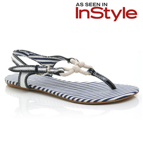 Canvas flip flop with buckled ankle strap and patent pining detail. Featuring a knotted rope and str