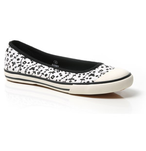 Round toe trainer-style canvas pump featuring rubber toe cap and all over floral print detail. Prett