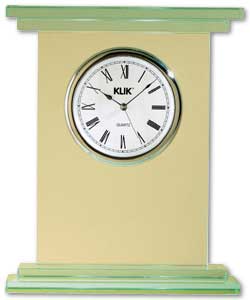 Tall glass mantel clock fitted with quartz pendulum movement.Chrome bezel and hands. White dial