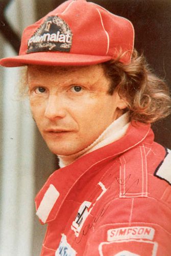 Niki Lauda posses for the camera in his Mclaren te