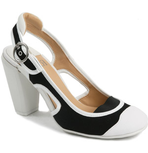 A unique and trendy round toe canvas sandal. The Lechic shoe features a rubber toe cap detail and hi