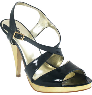Lirror, patent synthetic strappy sandal. Featuring a high plated heel, platform and cross over strap