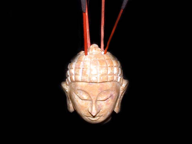 made from soapstone. They are approx. 2`` (5cm) high and have holes in the top of the head for the