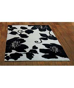 100 wool. Edges bound. Surface shampoo only. Suitable for moderate domestic use.Size 180 x 120cm/71 