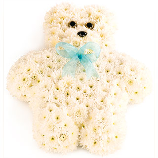 Where words are not enough a peaceful teddy with bow.